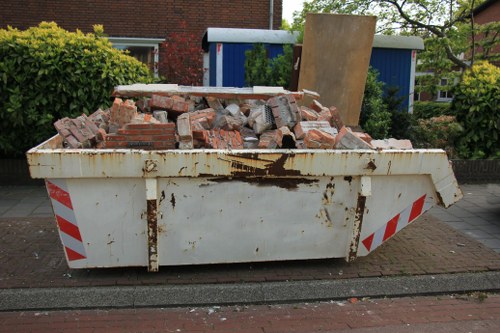 Professional home clearance team in North London clearing a living room