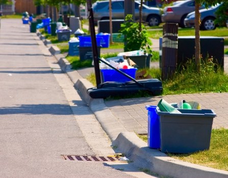 Workers handling household waste removal