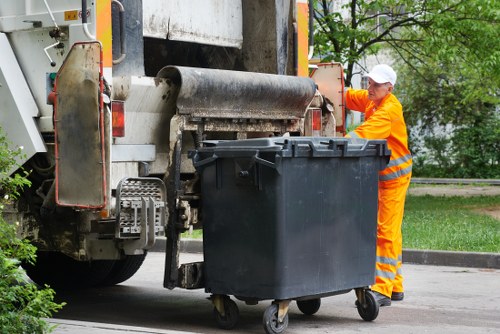 Waste disposal process in North London with collection trucks