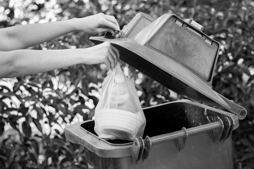 Bulk waste items being loaded for removal from a manor property