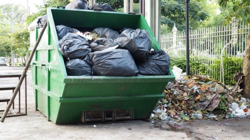 Van unloading household waste in Winchmore Hill